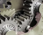 Close-up of wind turbine gearbox gears and bearings, illustrating how clean oil and high-efficiency oil filtration reduce wear and protect critical drivetrain components.