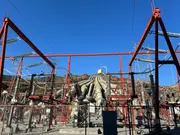 Electrical substation at a hydro power plant illustrating turbine lubrication systems used in power generation.