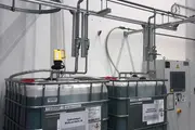 Centralized cutting fluid system with industrial tanks and piping