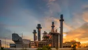 Gas-fired power generation facility at sunset, illustrating how clean oil and advanced oil filtration protect turbines and critical systems to ensure stable and efficient power production.