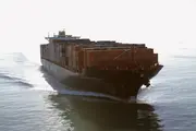 Large container ship at sea illustrating marine hydraulic control and engine lubrication systems.