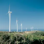 Wind turbines operating in an open landscape, representing how clean oil and advanced oil filtration stabilise oil condition and enable structured maintenance planning in wind energy operations.