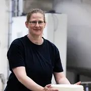 Employee portrait of an operator in a production setting.