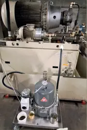 CJC® Fluid Care System installed next to a servo-hydraulic testing machine for hydraulic oil filtration.