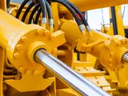 Industrial hydraulic system with cylinders and hoses used in heavy machinery. 