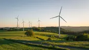 Wind turbines across a rural landscape, representing wind turbine gearboxes where clean oil and effective oil filtration protect drivetrain components and ensure reliable renewable energy production.