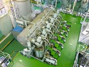 Large marine engine room with multiple engines and lubrication systems.